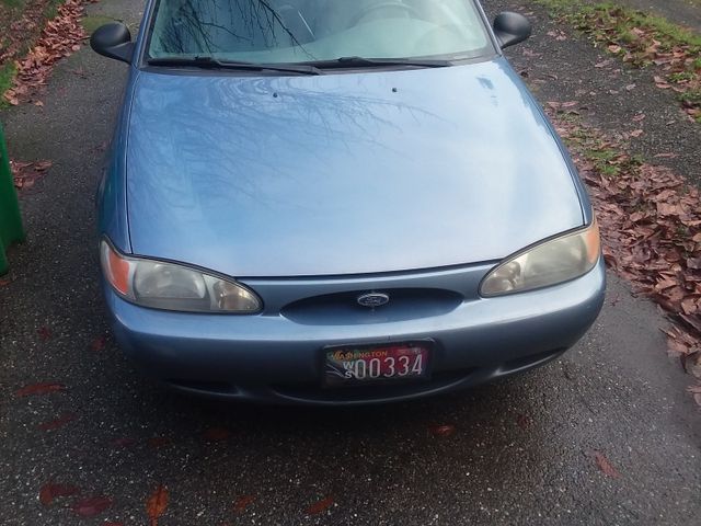 1999 Ford Escort SE, Graphite Blue Clearcoat Metallic (Blue), Front Wheel