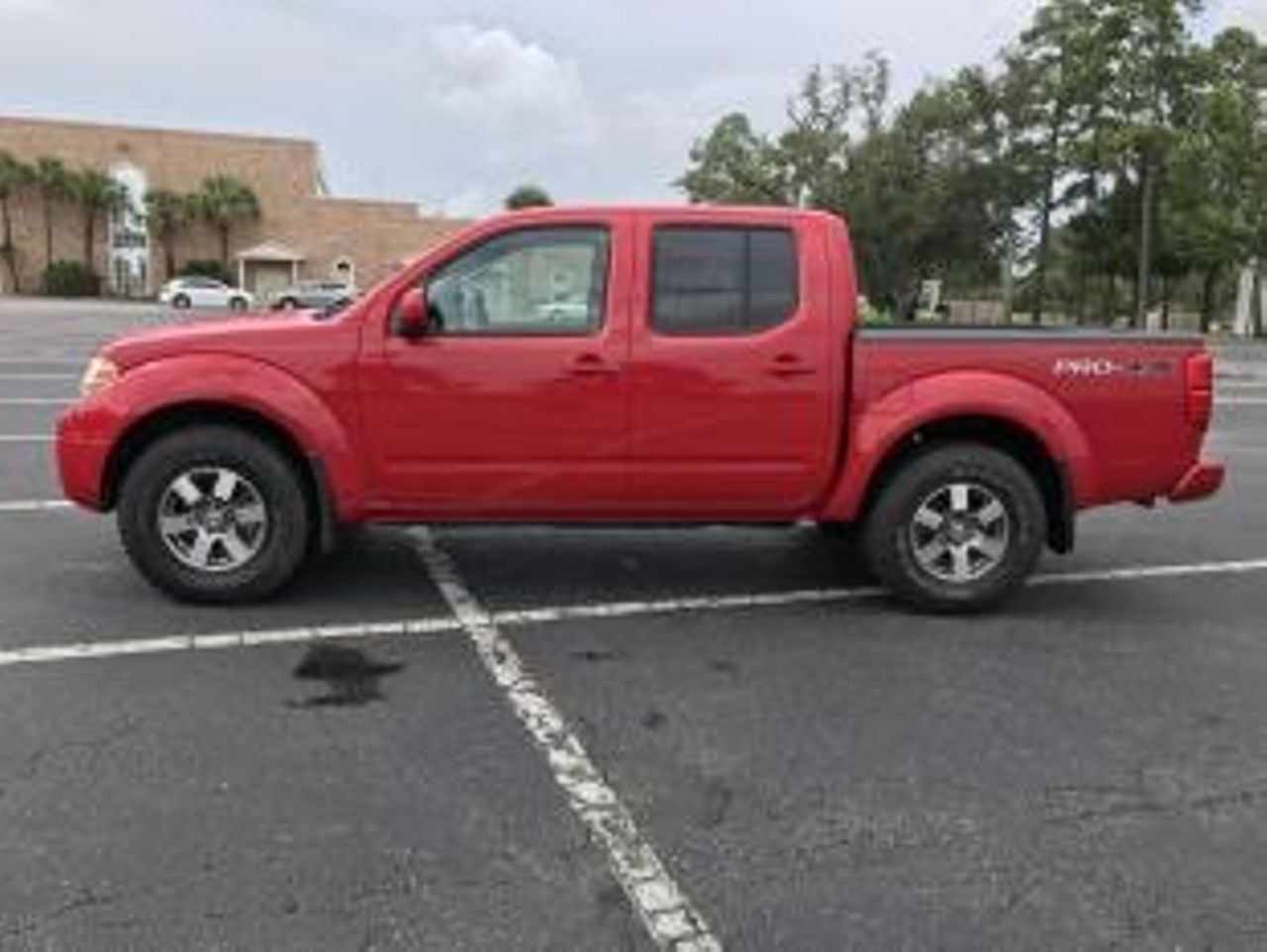 2010 Nissan Frontier PRO-4X | Sioux Falls, SD, Red Alert (Red & Orange), 4x4