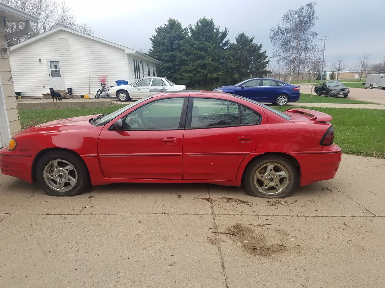 2004 Pontiac Grand Am | Beresford, SD, Victory Red (Red & Orange), Front Wheel