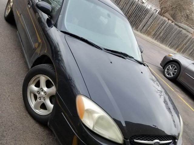 2002 Ford Taurus SE, Black Clearcoat (Black), Front Wheel