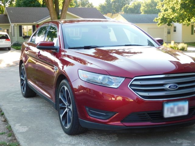 2014 Ford Taurus SEL, Ruby Red Metallic Tinted Clearcoat (Red & Orange), Front Wheel