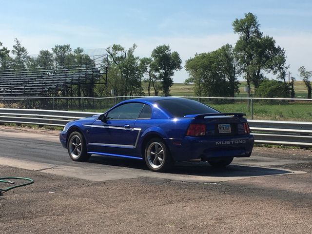 2004 Ford Mustang GT Deluxe, Sonic Blue Clearcoat Metallic (Blue), Rear Wheel