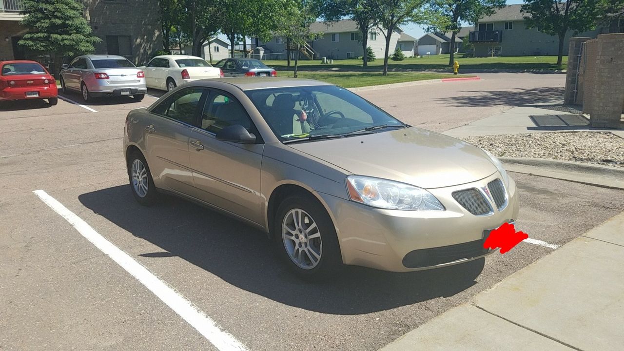 2006 Pontiac G6 | Canton, SD, Fusion Orange Metallic (Gold & Cream), Front Wheel