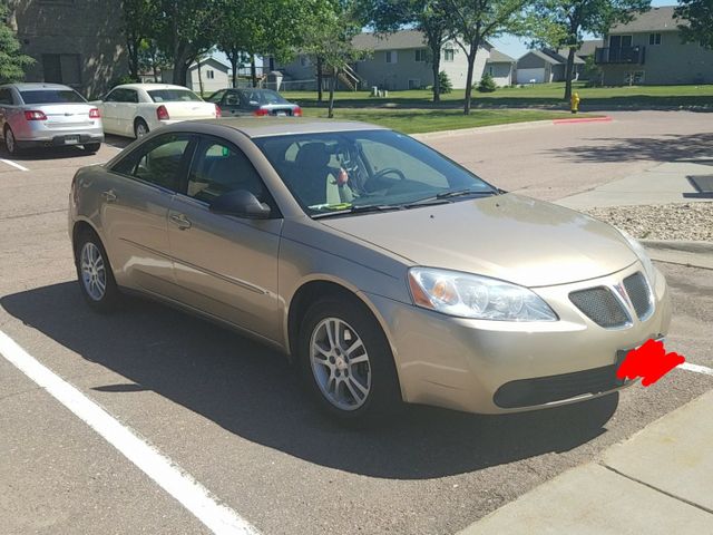 2006 Pontiac G6, Fusion Orange Metallic (Gold & Cream), Front Wheel