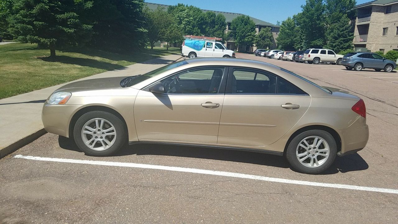 2006 Pontiac G6 | Canton, SD, Fusion Orange Metallic (Gold & Cream), Front Wheel