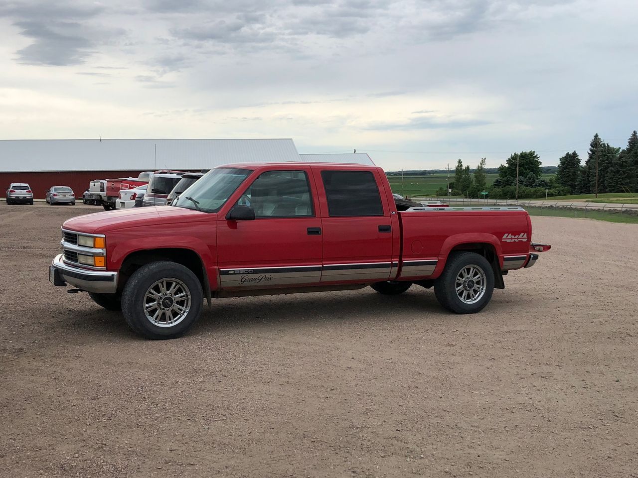 1999 Chevrolet C/K 2500 Series K2500 LS | Baltic, SD, Red & Orange, 4 Wheel