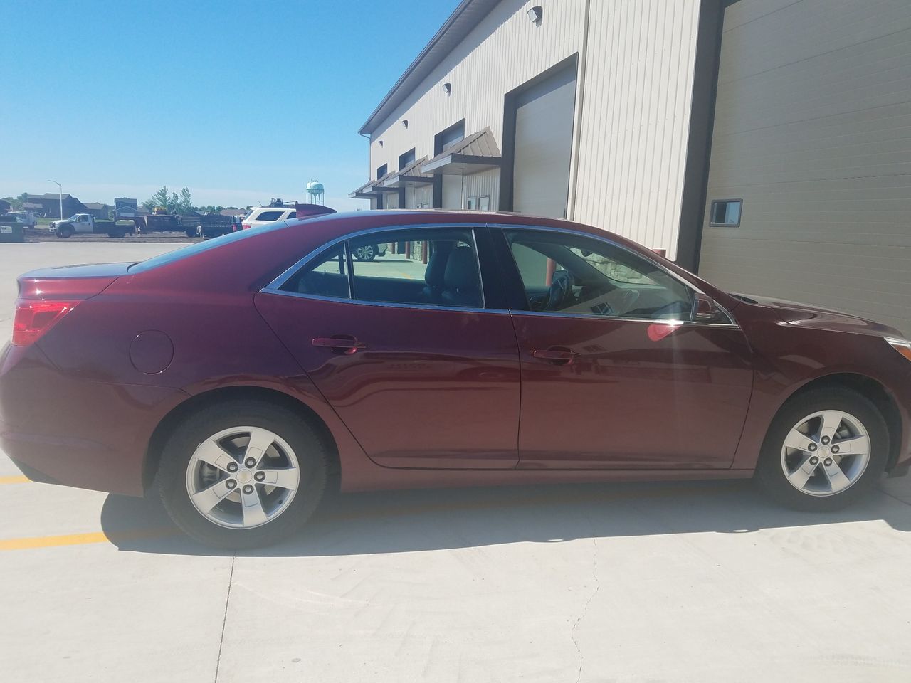 2016 Chevrolet Malibu | Sioux Falls, SD, Butte Red Metallic (Red & Orange), Front Wheel