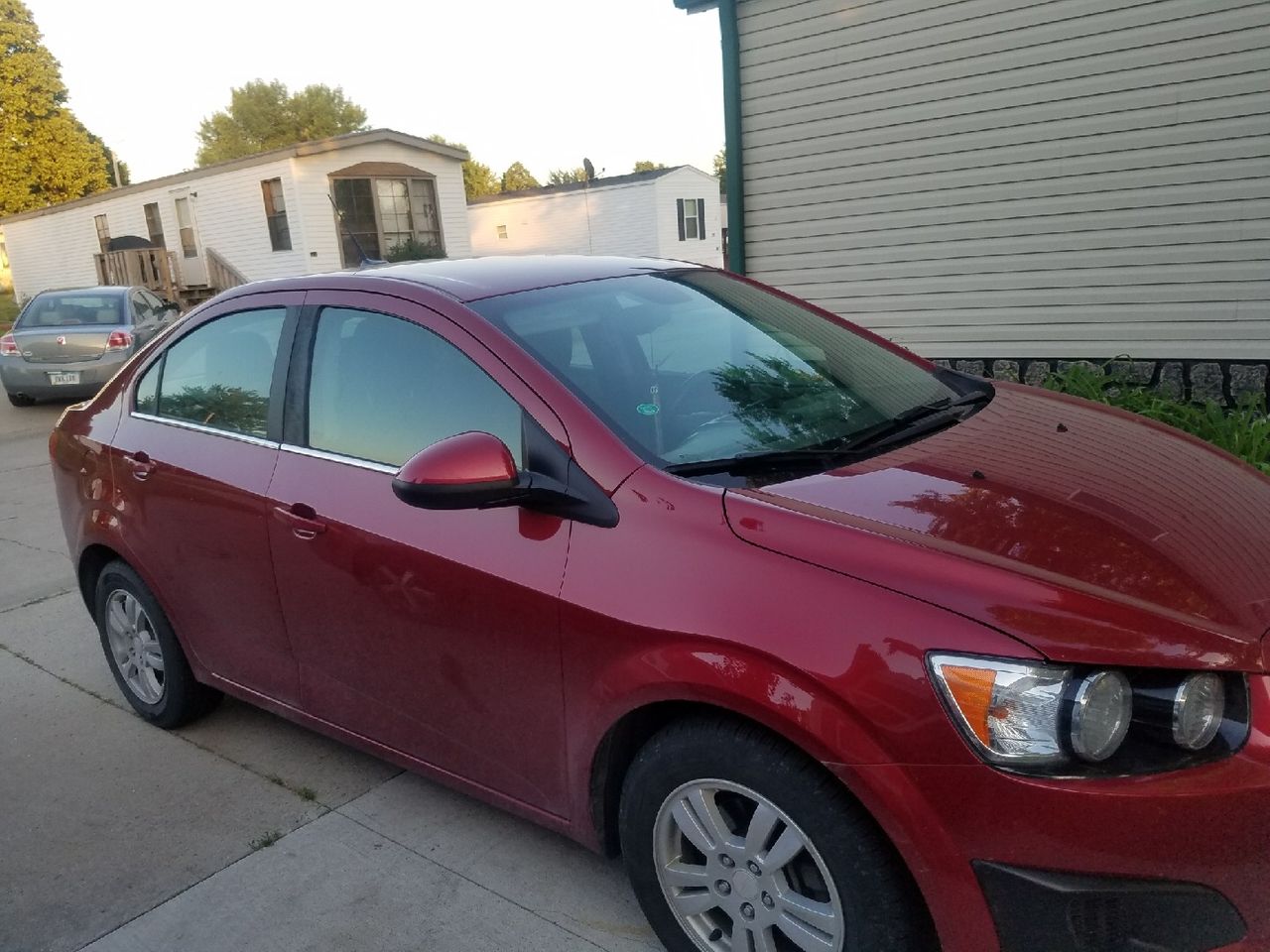 2013 Chevrolet Sonic | Newton, IA, Victory Red (Red & Orange), Front Wheel