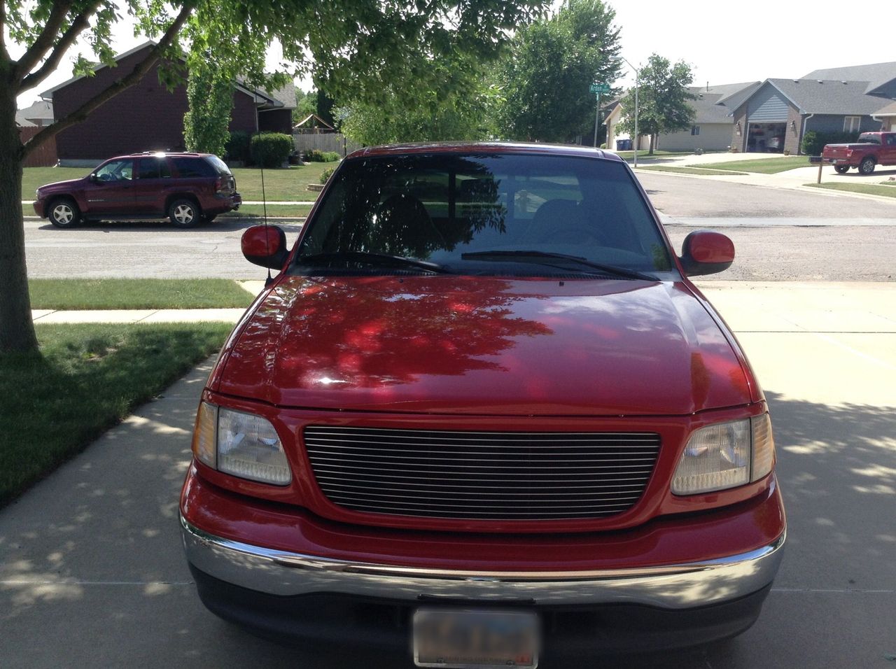 1999 Ford F-150 Lariat | Sioux Falls, SD, Bright Red Clearcoat (Red & Orange), Rear Wheel