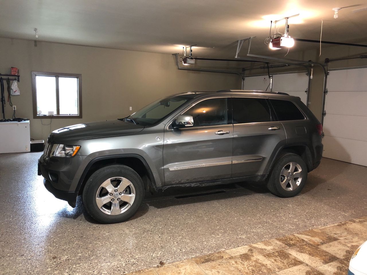 2012 Jeep Grand Cherokee Overland | Hartford, SD, Bright Silver Metallic Clear Coat (Silver)