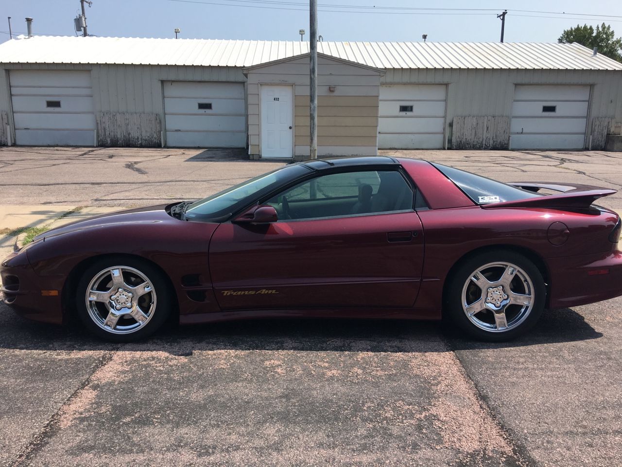 2000 Pontiac Firebird Trans Am | Sioux Falls, SD, Maple Red Metallic (Red & Orange), Rear Wheel