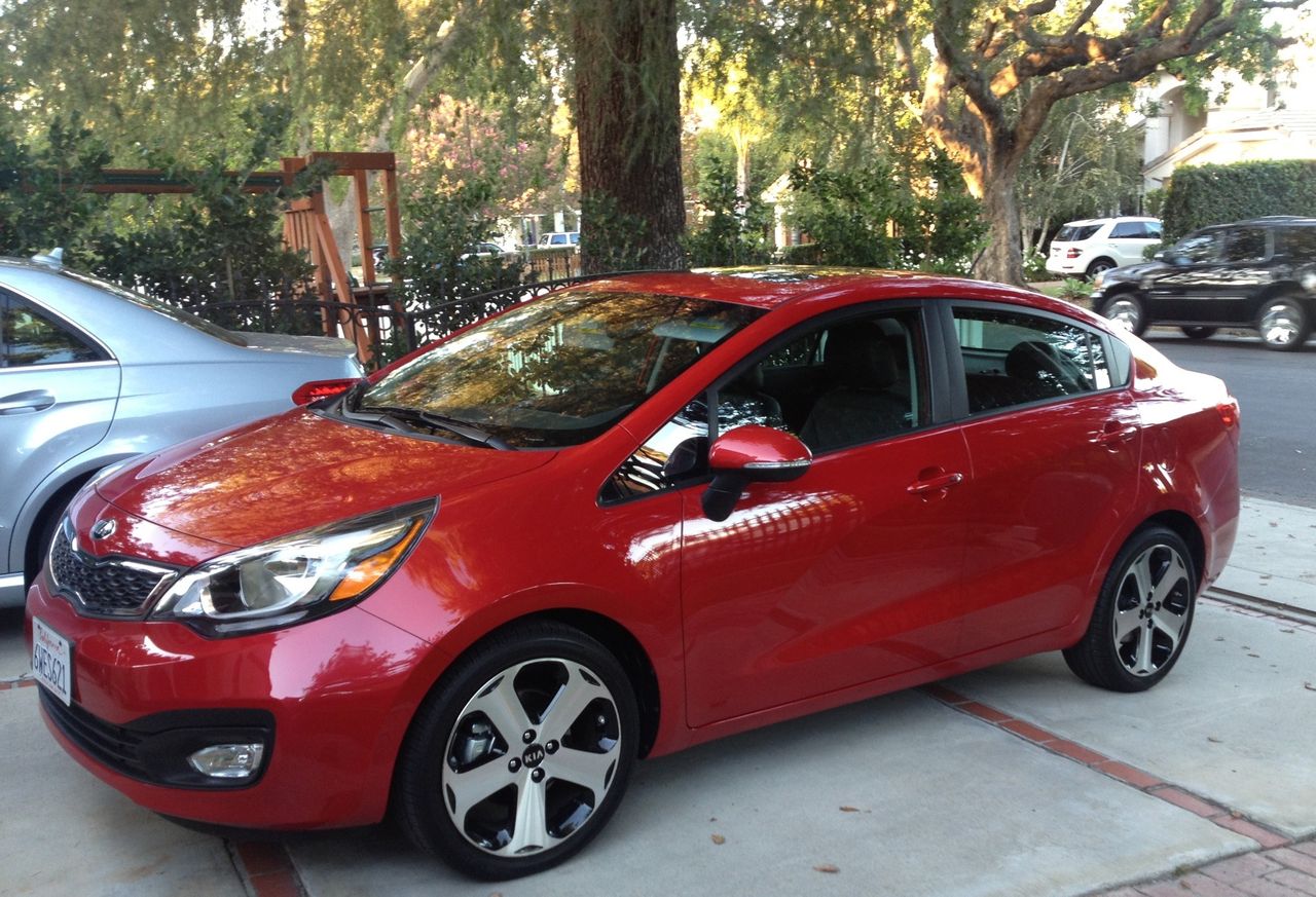 2013 Kia Rio | Sioux Falls, SD, Signal Red (Red & Orange), Front Wheel