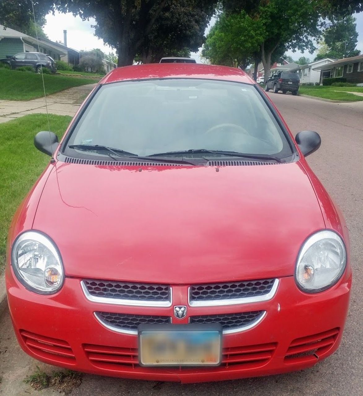 2005 Dodge Neon SE | Sioux Falls, SD, Flame Red Clearcoat (Red & Orange), Front Wheel