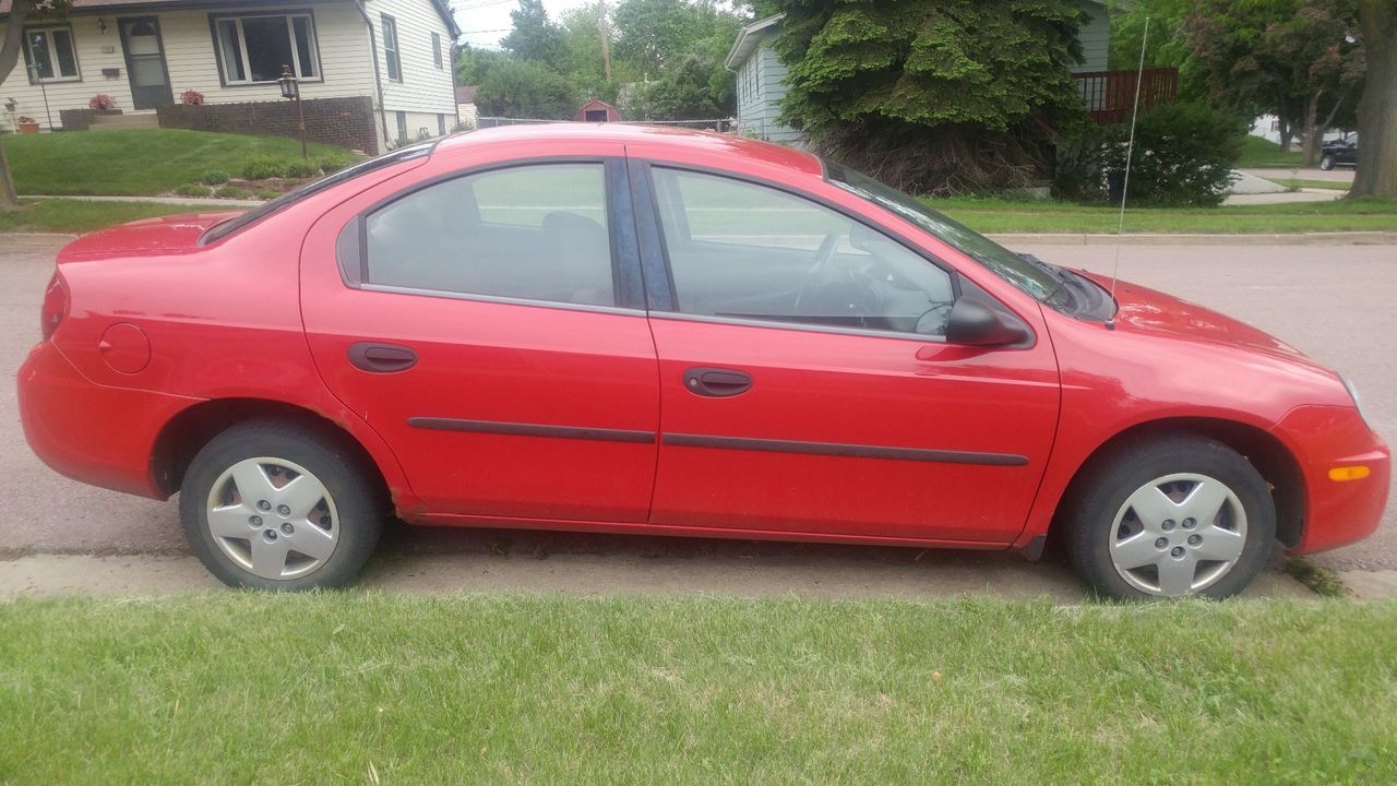 2005 Dodge Neon SE | Sioux Falls, SD, Flame Red Clearcoat (Red & Orange), Front Wheel