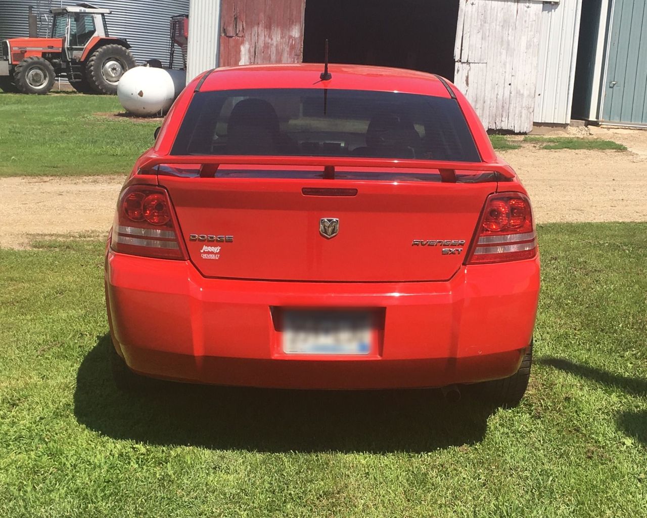 2009 Dodge Avenger | Reading, MN, Inferno Red Crystal Pearl Coat (Red & Orange), Front Wheel
