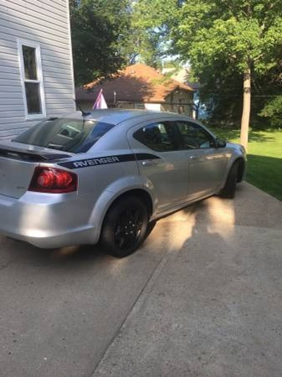 2011 Dodge Avenger | Hills, MN, Bright Silver Metallic Clear Coat (Silver), Front Wheel