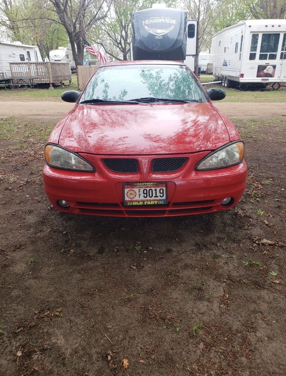 2004 Pontiac Grand Am | Hurley, SD, Victory Red (Red & Orange), Front Wheel