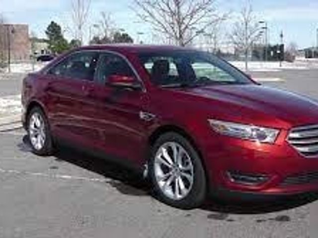2013 Ford Taurus SEL, Ruby Red Metallic Tinted Clear Coat (Red & Orange), Front Wheel
