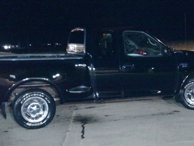 2001 Ford F-150 Lariat, Black Clearcoat (Black), Rear Wheel