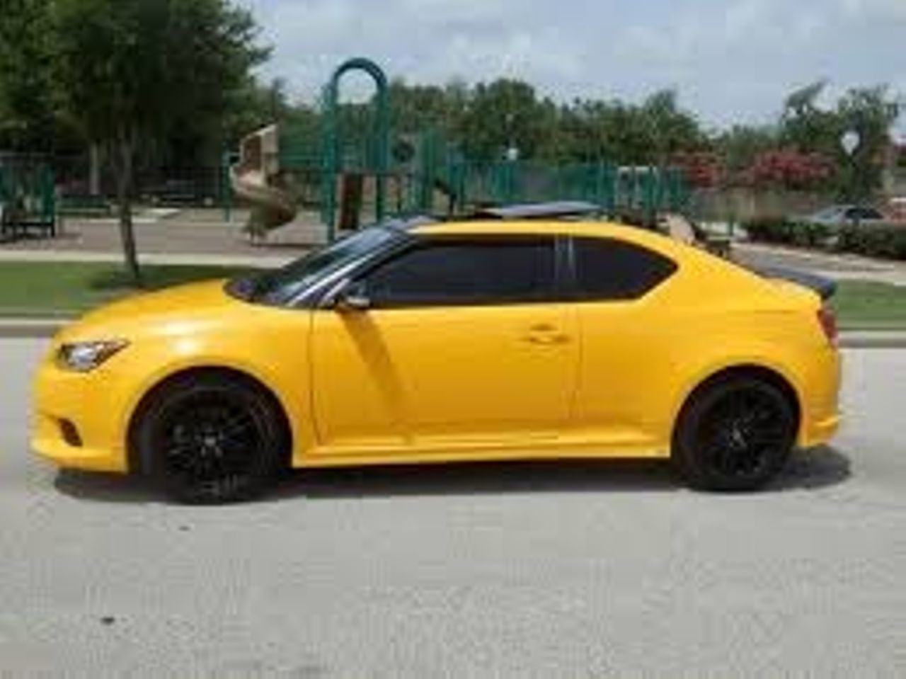 2012 Scion tC RS 7.0 | Sioux Falls, SD, High Voltage (Yellow), Front Wheel