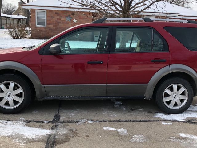 2006 Ford Freestyle SEL, Redfire Clearcoat Metallic (Red & Orange), Front Wheel