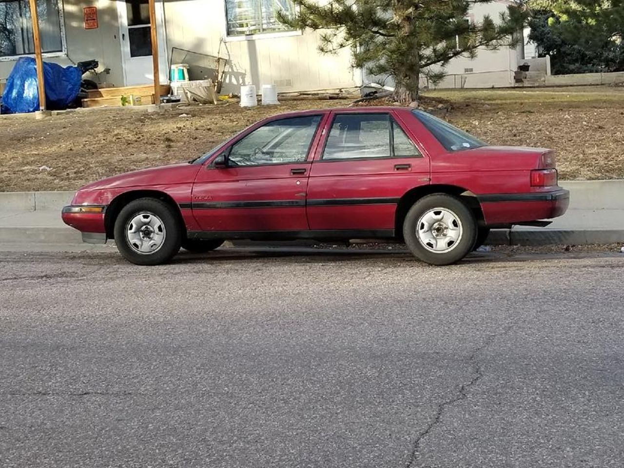 1992 Chevrolet Corsica LT | Colorado Springs, CO, Dark Maple Metallic (Red & Orange), Front Wheel