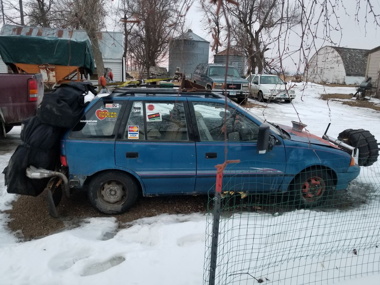 1994 Geo Metro Base | Kenneth, MN, Sky Blue Metallic (Blue), Front Wheel