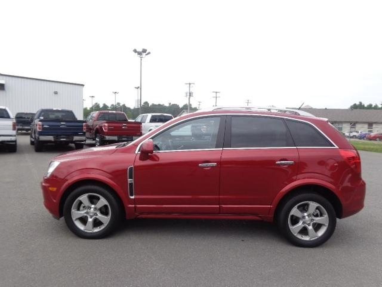 2013 Chevrolet Captiva Sport | Sioux Falls, SD, Crystal Red Tintcoat (Red & Orange), Front Wheel