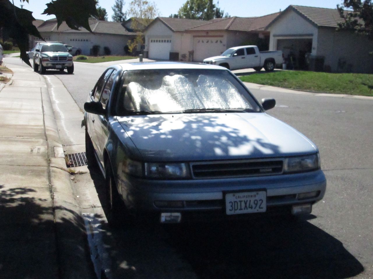 1991 Nissan Maxima GXE | Sacramento, CA, Satin White Pearlglow (White), Front Wheel