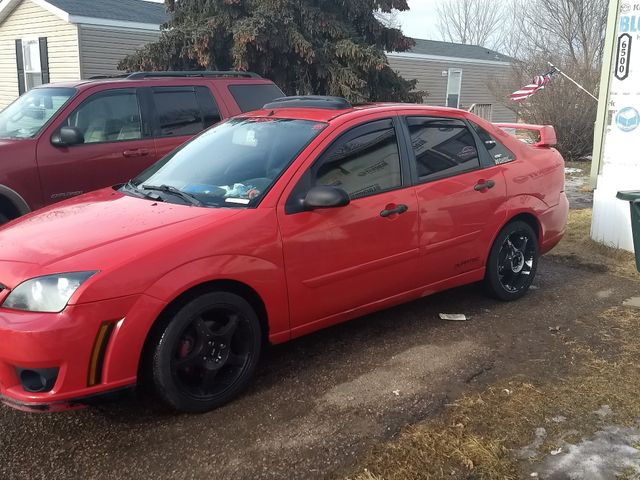 2006 Ford Focus ZX4 SES, Infra-Red Clearcoat (Red & Orange), Front Wheel
