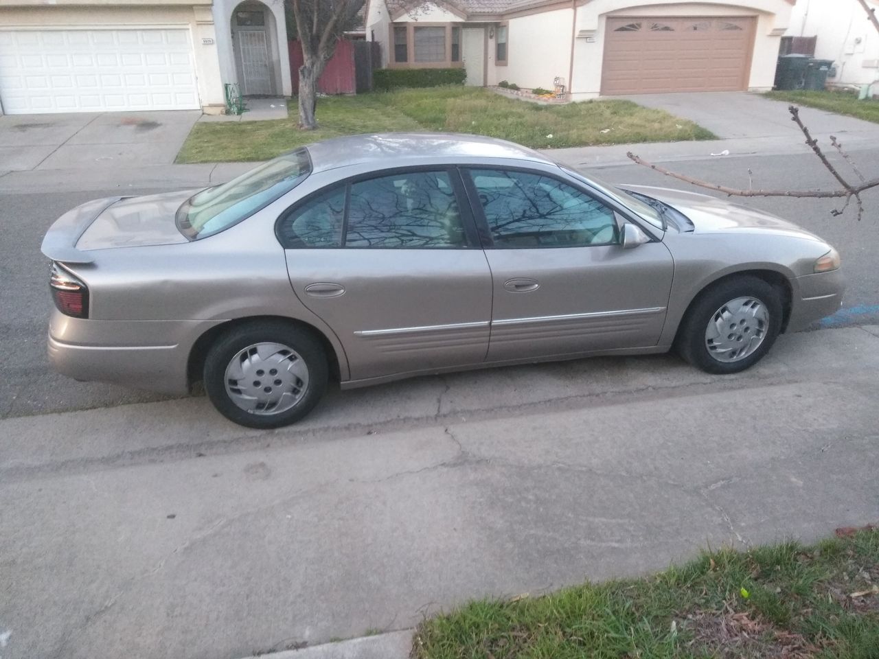 2003 Pontiac Bonneville SE | Sacramento, CA, Light Bronzemist Metallic (Brown & Beige), Front Wheel