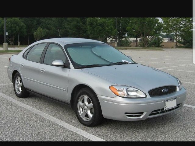 2002 Ford Taurus LX, Silver Frost Clearcoat Metallic (Silver), Front Wheel