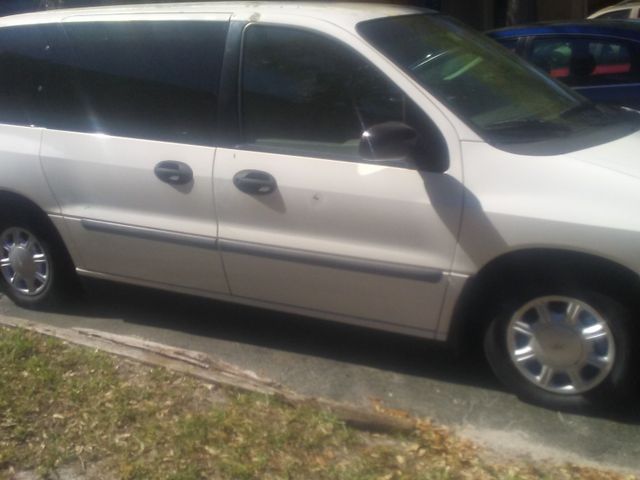 2000 Ford Windstar Base, Silver Frost Clearcoat Metallic (Silver), Front Wheel