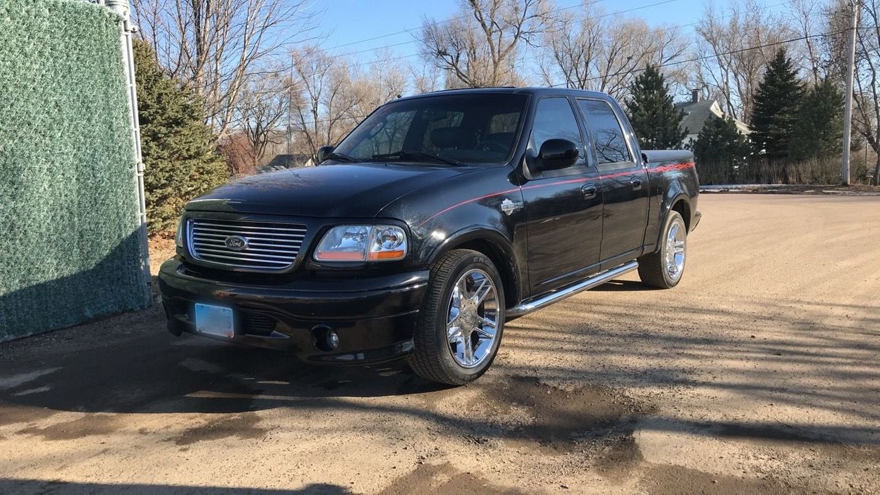 2002 Ford F-150 Harley-Davidson | Sioux Falls, SD, Black Clearcoat (Black), Rear Wheel