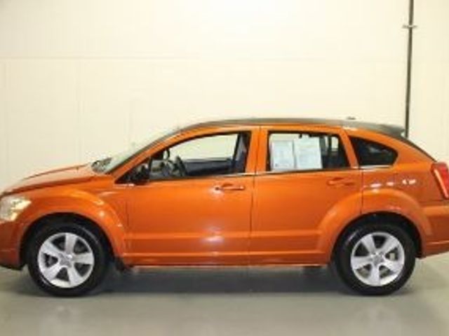 2011 Dodge Caliber, Mango Tango Pearl Coat (Red & Orange), Front Wheel