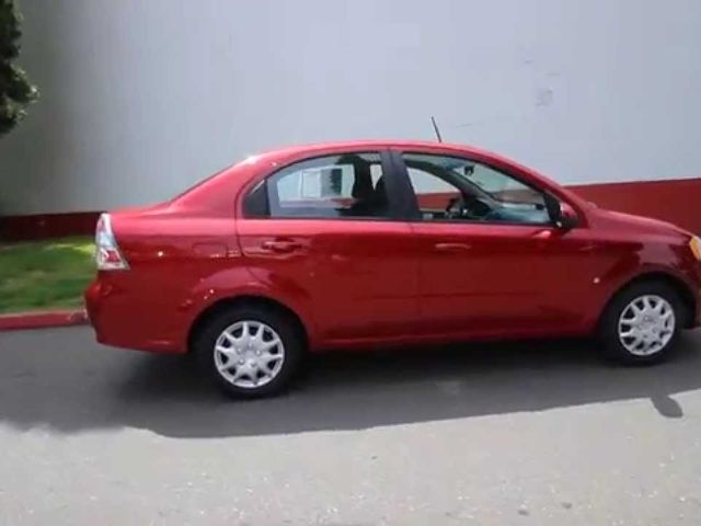 2006 Chevrolet Aveo LS, Sport Red (Red & Orange), Front Wheel