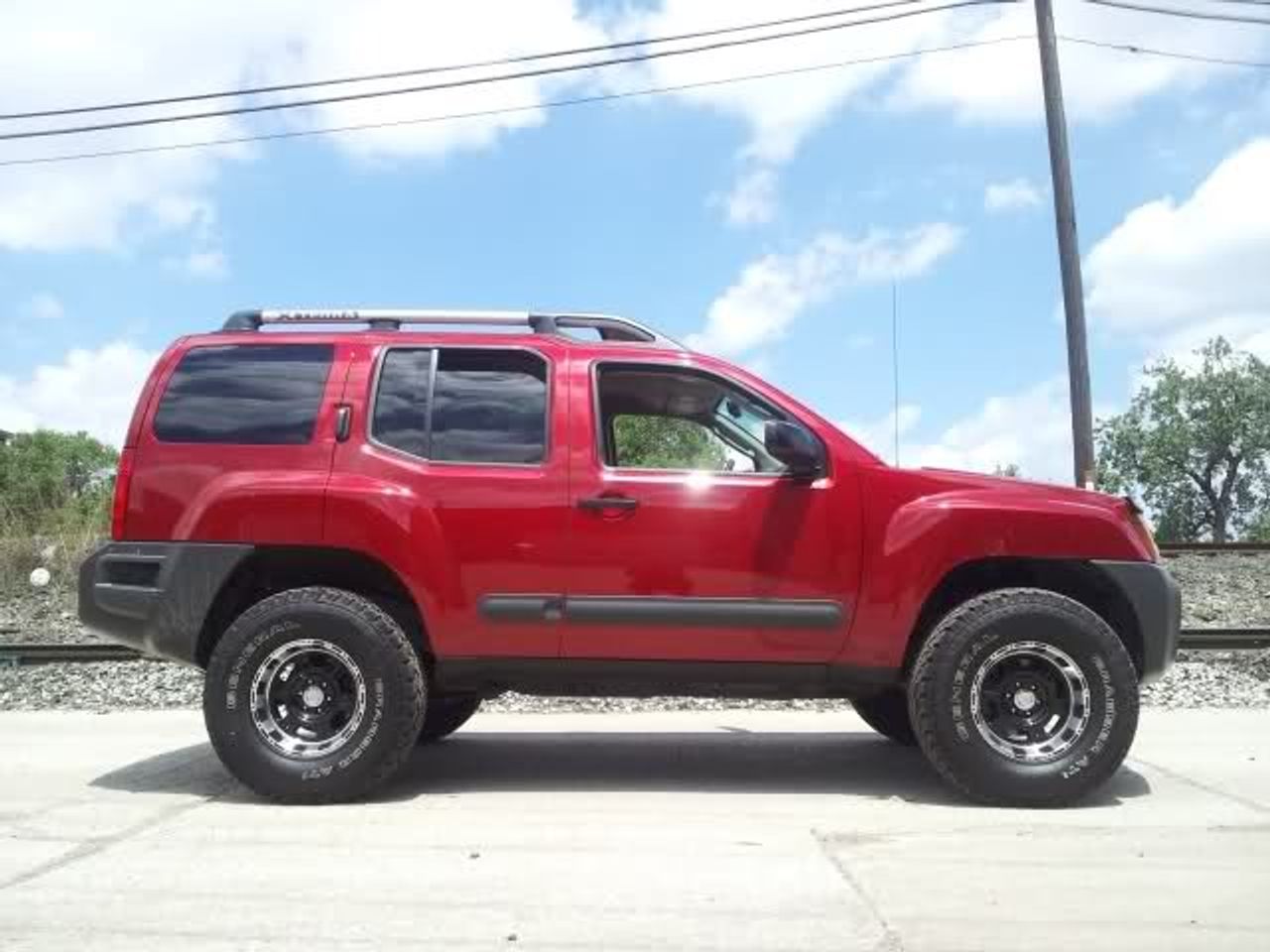 2010 Nissan Xterra | Sioux Falls, SD, Red Brick (Red & Orange)