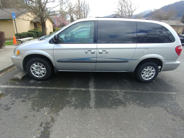2003 Dodge Caravan Sport, Bright Silver Metallic Clearcoat (Silver), Front Wheel