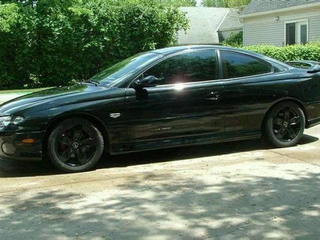 2004 Pontiac GTO Base, Phantom Black Metallic (Black), Rear Wheel