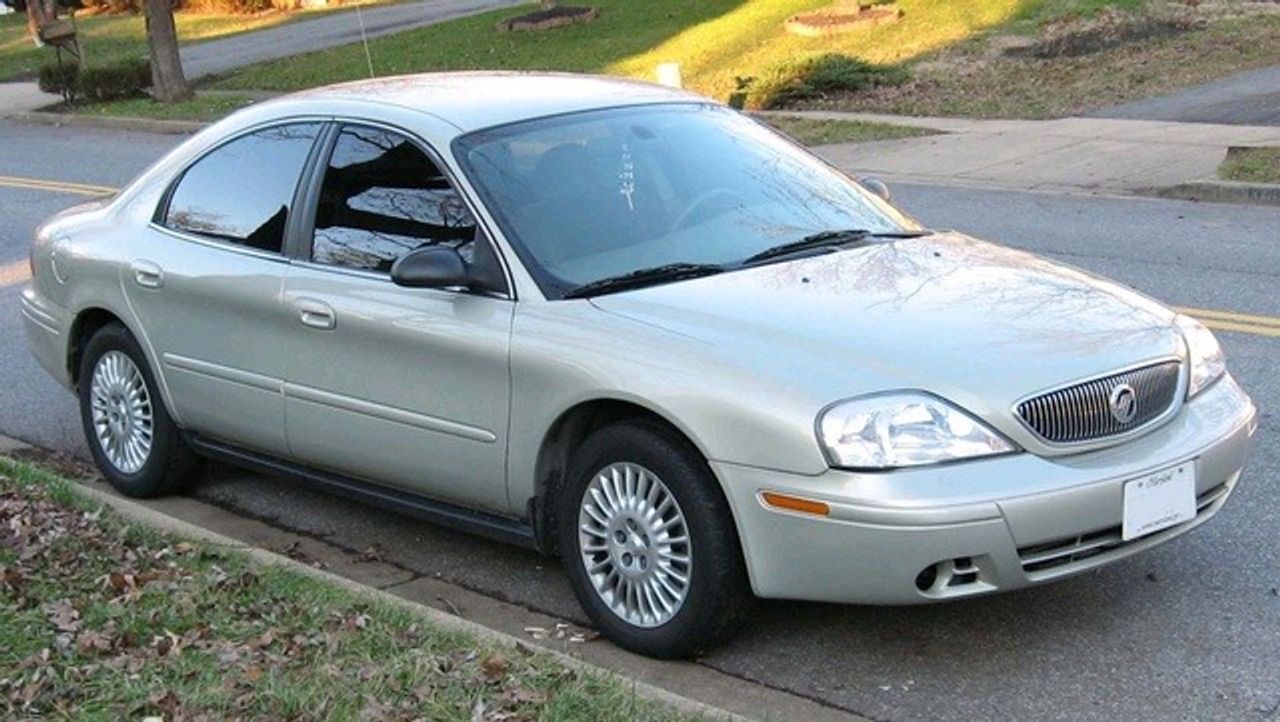 2004 Mercury Sable | Tea, SD, Silver Frost Clearcoat Metallic (Silver), Front Wheel
