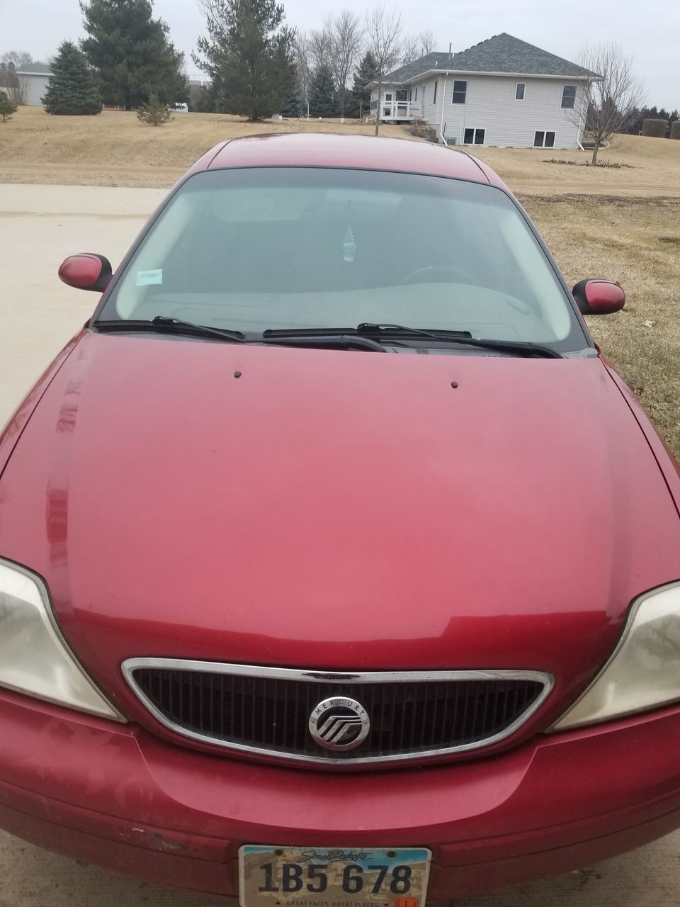 2002 Mercury Sable | Sioux Falls, SD, Matador Red Clearcoat Metallic (Red & Orange), Front Wheel