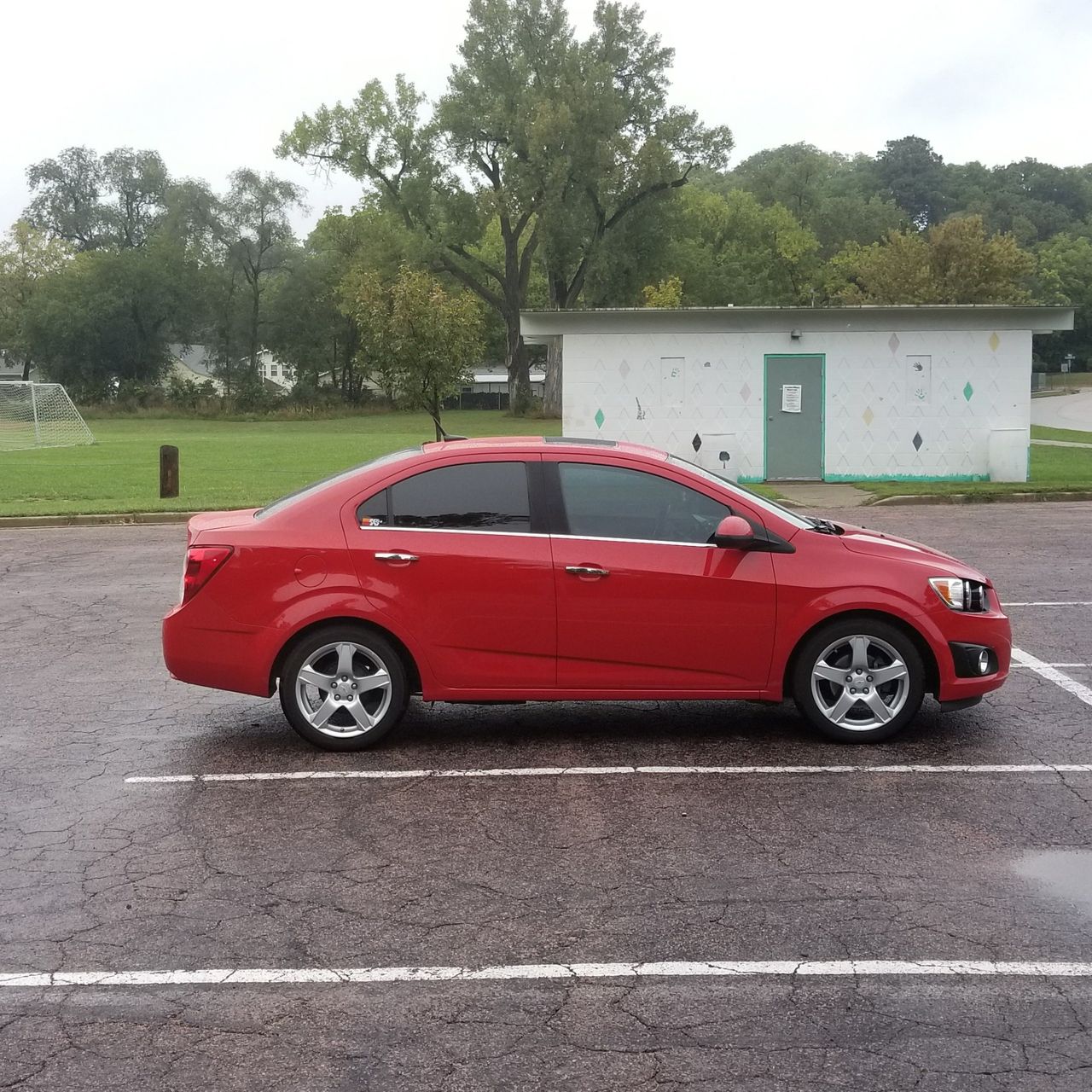 2012 Chevrolet Sonic LTZ | Sioux Falls, SD, Victory Red (Red & Orange), Front Wheel