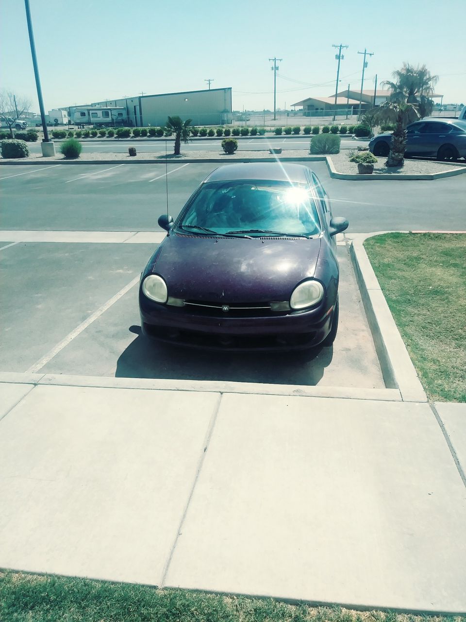 2000 Dodge Neon | Carlsbad, NM, Deep Cranberry Pearlcoat (Red & Orange), Front Wheel