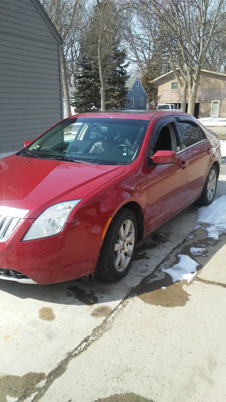 2010 Mercury Milan V6 Premier | Sioux Falls, SD, Sangria Red Clearcoat Metallic (Red & Orange), Front Wheel