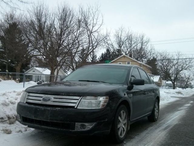 2008 Ford Taurus SEL, Black Clearcoat (Black), Front Wheel