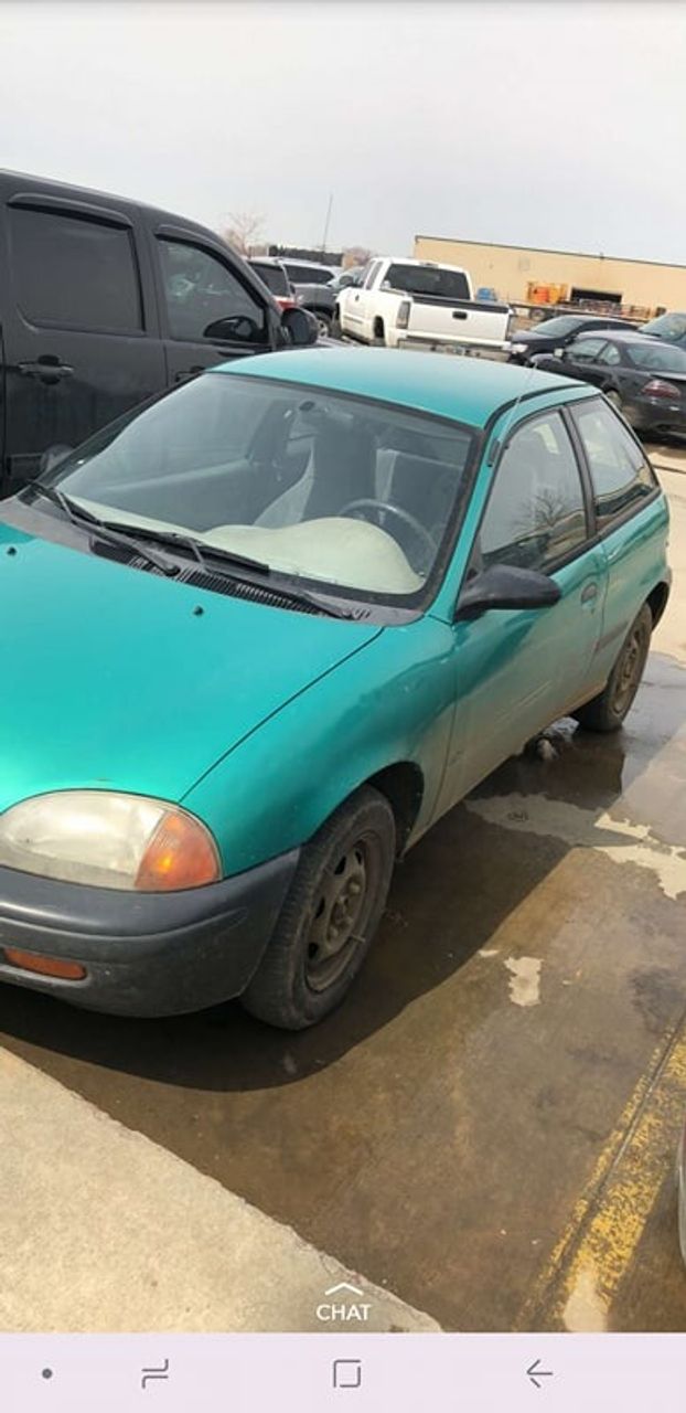 1994 Geo Metro Base | Parker, SD, Tropical Green Metallic (Green), Front Wheel