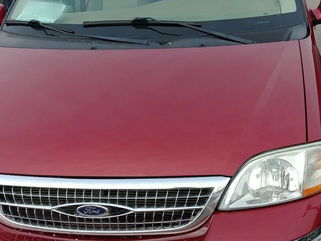 2003 Ford Windstar, Matador Red Clearcoat Metallic (Red & Orange), Front Wheel