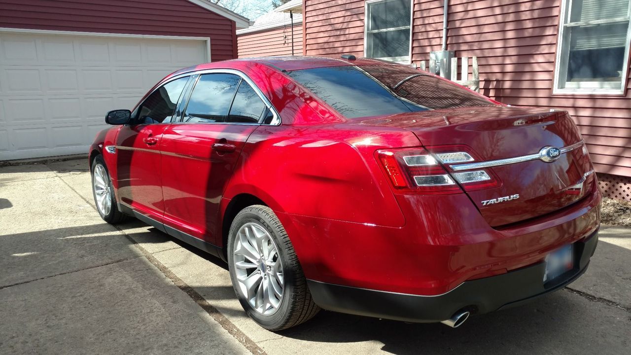 2015 Ford Taurus Limited | Lennox, SD, Ruby Red Metallic Tinted Clearcoat (Red & Orange), Front Wheel