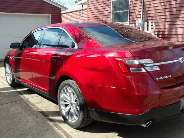 2015 Ford Taurus Limited, Ruby Red Metallic Tinted Clearcoat (Red & Orange), Front Wheel