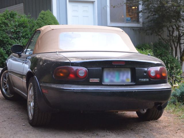 1994 Mazda MX-5 Miata Base, Brilliant Black (Black), Rear Wheel